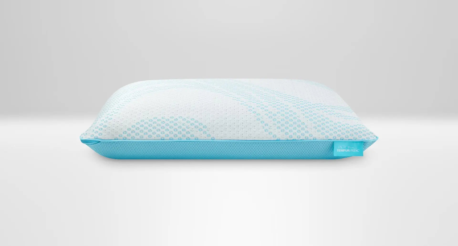 Tempur-Pedic Breeze ProLo Pillow with cooling cover and contoured design for enhanced comfort and support during sleep.