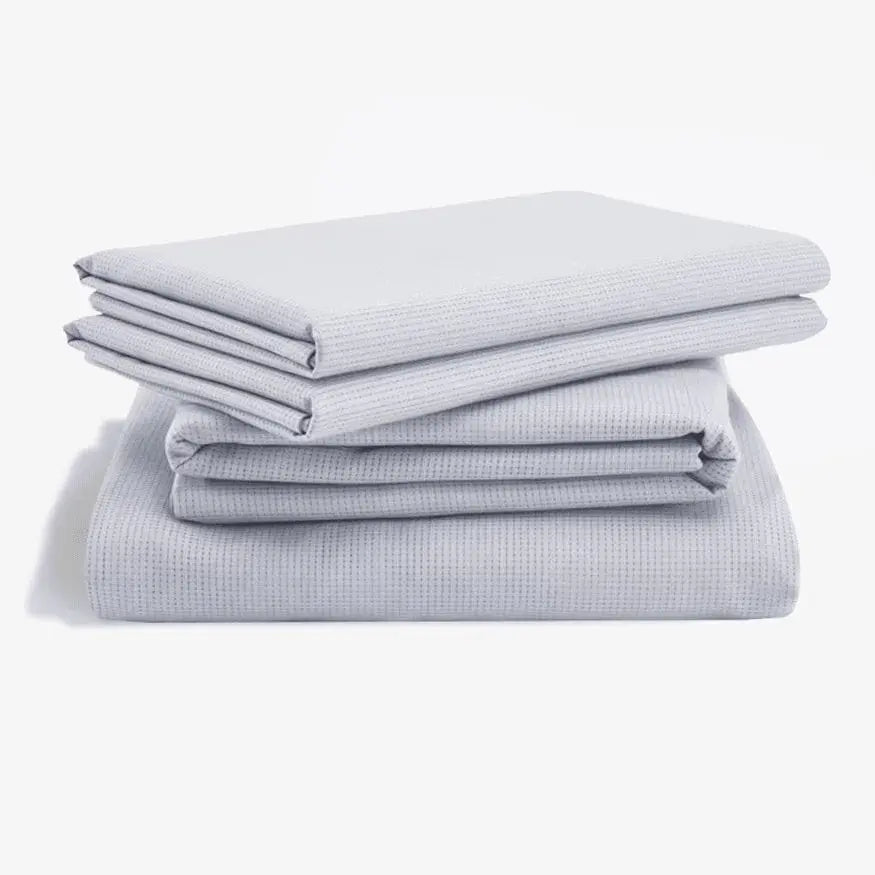 Tempur-Pedic ProAir sheet set with white mesh breathable fabric, featuring smooth, soft bedding for comfortable sleep.