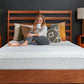 Tempur-Pedic TEMPUR-Protect mattress protector on a bed, showing a soft, fitted fabric cover for protection and comfort.