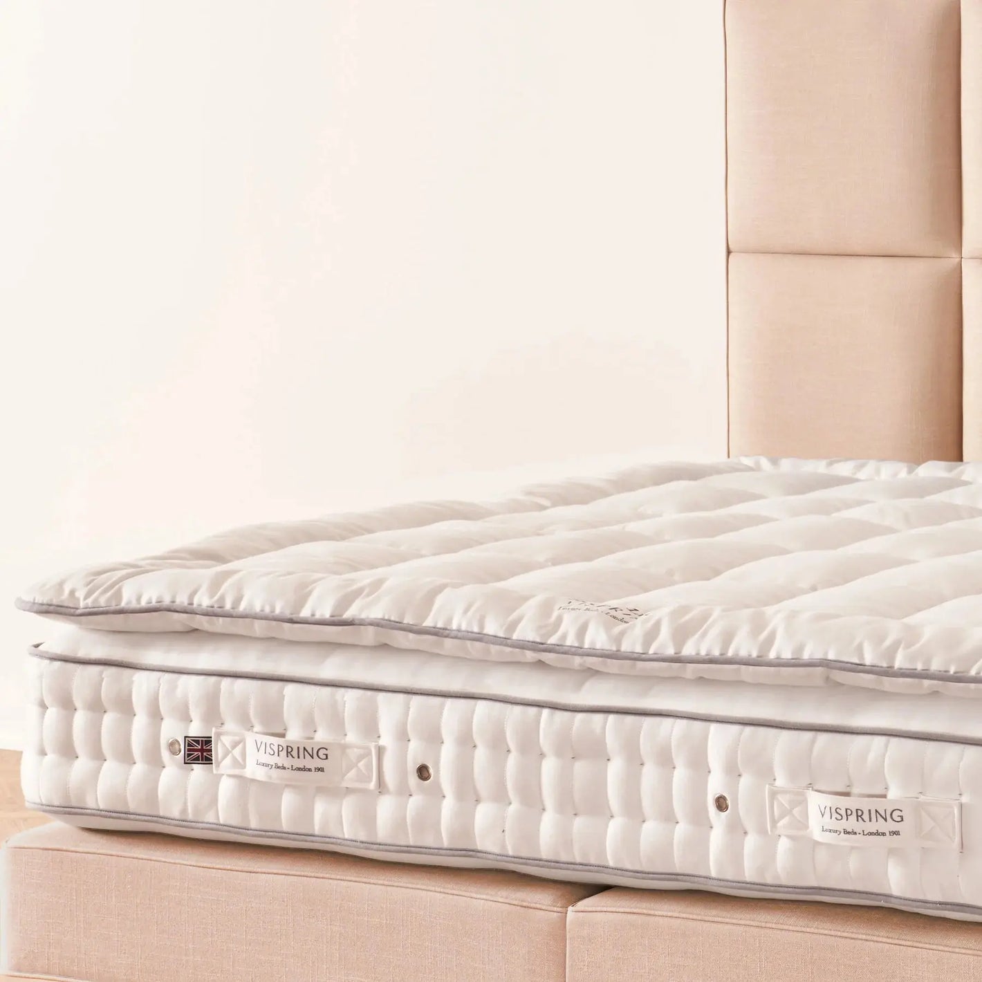 Close-up of the Vispring Heaven Luxury Topper showcasing its plush, high-quality fabric and luxurious design for enhanced sleep comfort.