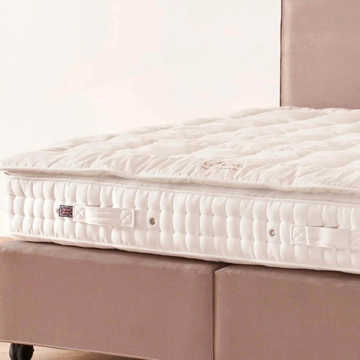 Vispring Heaven Topper showcasing plush, luxurious bedding with a soft, padded surface and elegant design for enhanced comfort.