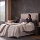 Malouf classic cotton sheet set with smooth, white fabric and neatly folded sheets showing the soft, high-quality material.
