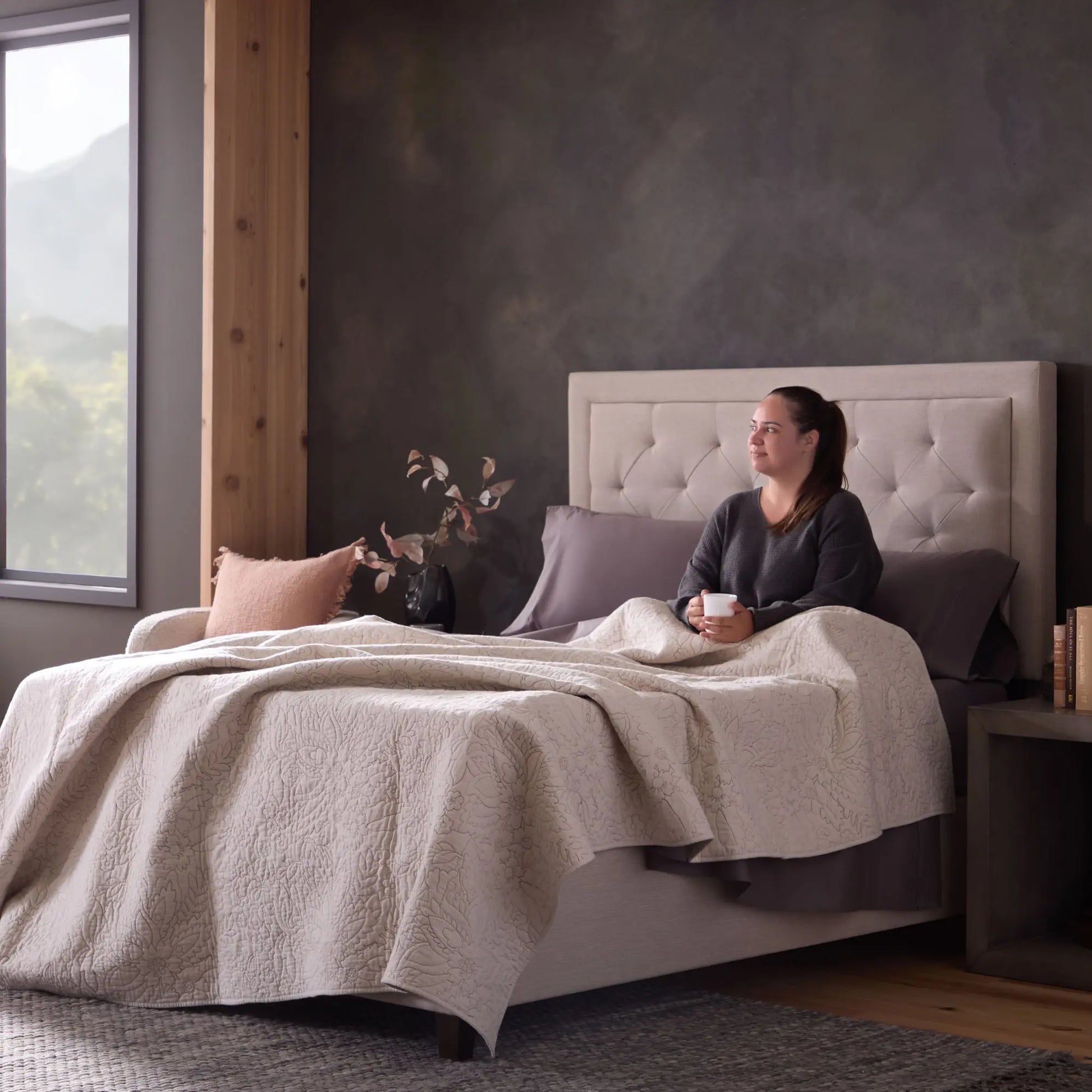 Malouf classic cotton sheet set with smooth, white fabric and neatly folded sheets showing the soft, high-quality material.