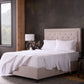 Malouf classic cotton sheet set with white fitted and flat sheets, smooth and soft fabric for comfortable sleep.