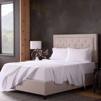 Malouf classic cotton sheet set with white fitted and flat sheets, smooth and soft fabric for comfortable sleep.