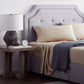 Ecru botanical sheet set made with Malouf TENCEL Lyocell fiber, featuring soft, breathable fabric and botanical-inspired design.