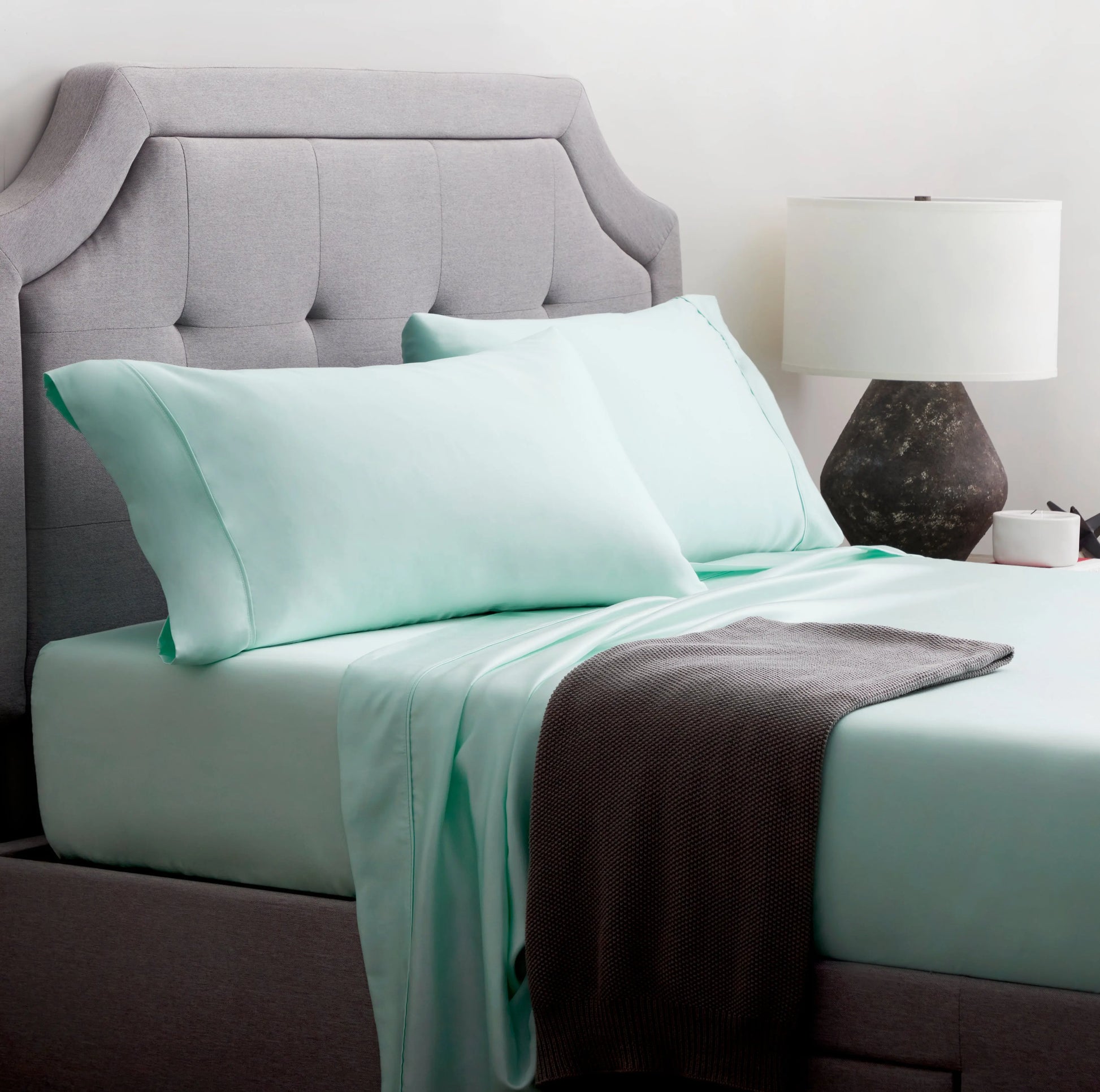 Malouf botanical sheet set made with TENCEL Lyocell fiber, showing soft, breathable fabric in a close-up view.