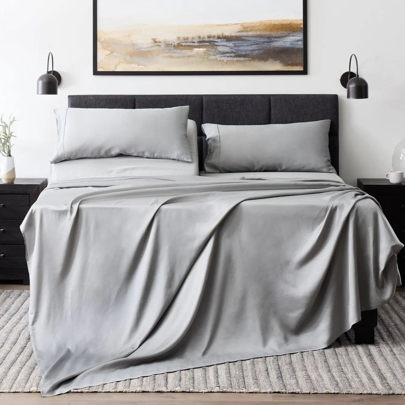 Malouf botanical sheet set made with TENCEL Lyocell fiber, featuring smooth, breathable fabric in a neatly arranged bed.
