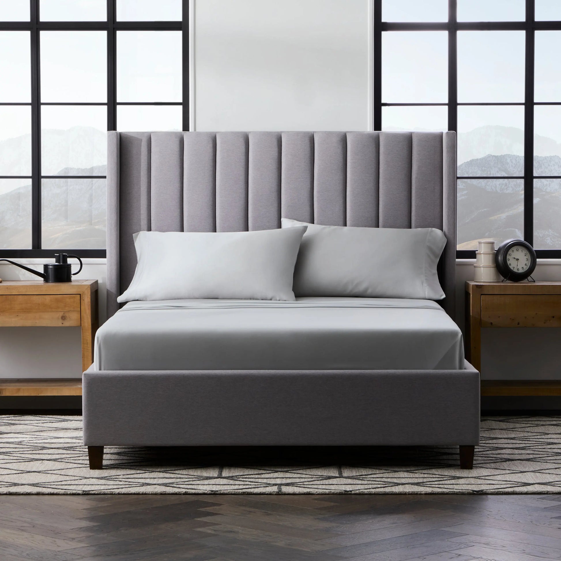 Malouf smooth bamboo rayon sheet set in ash color, showing soft, crisp bed sheets with a gentle sheen and natural fiber texture.