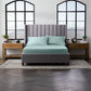 Malouf smooth bamboo rayon sheet set in ash color, showing soft, lightweight bedding with neatly folded sheets and pillowcases.