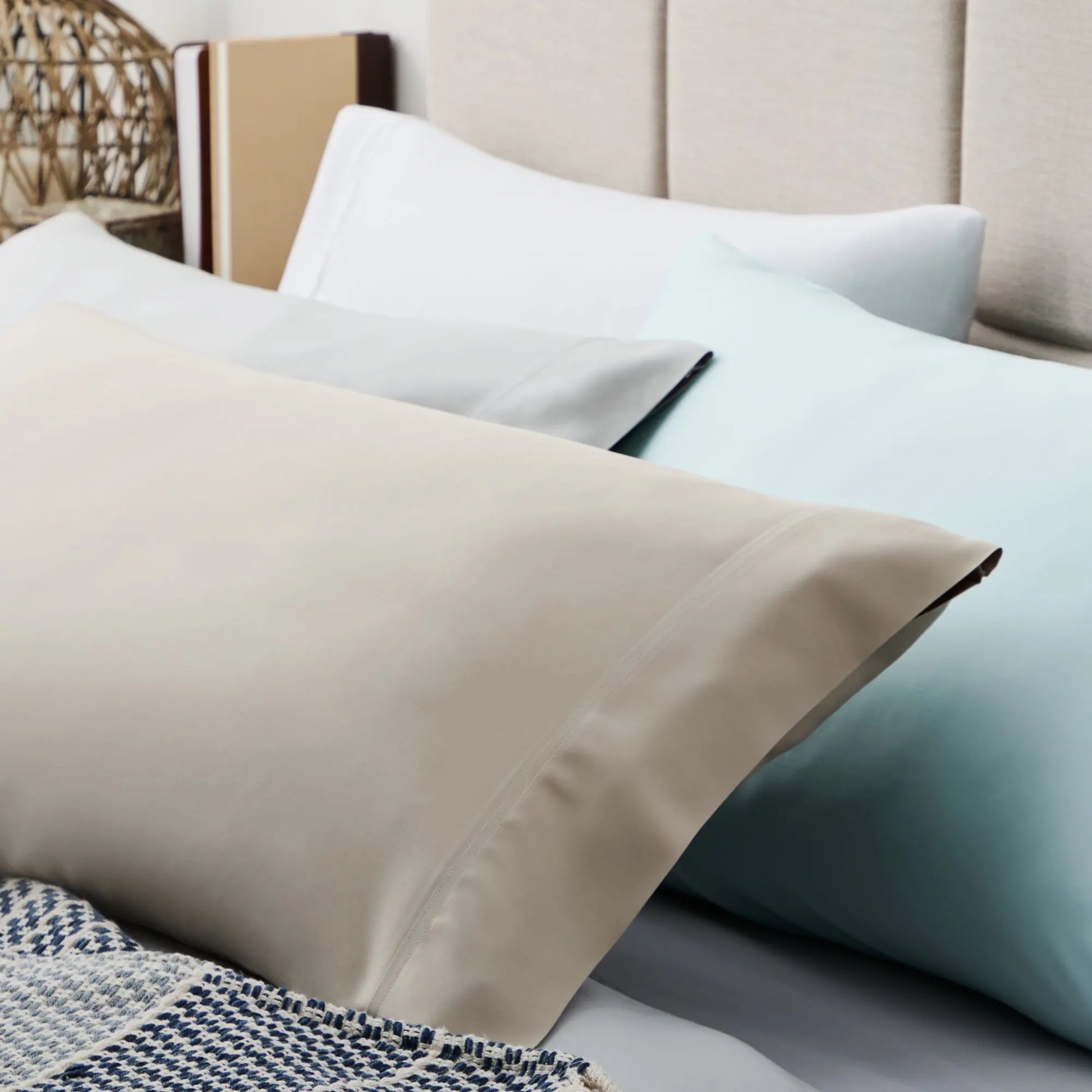 Malouf smooth bamboo rayon sheet set with soft, breathable fabric displayed on a neatly made bed.