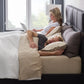 Malouf smooth bamboo rayon sheet set with fitted and flat sheets, showcasing soft, breathable fabric in a neutral color.
