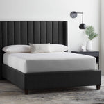 Malouf Five Sided and OmniPhase mattress protector on a bed, showing its fitted design and protective fabric for bedding.
