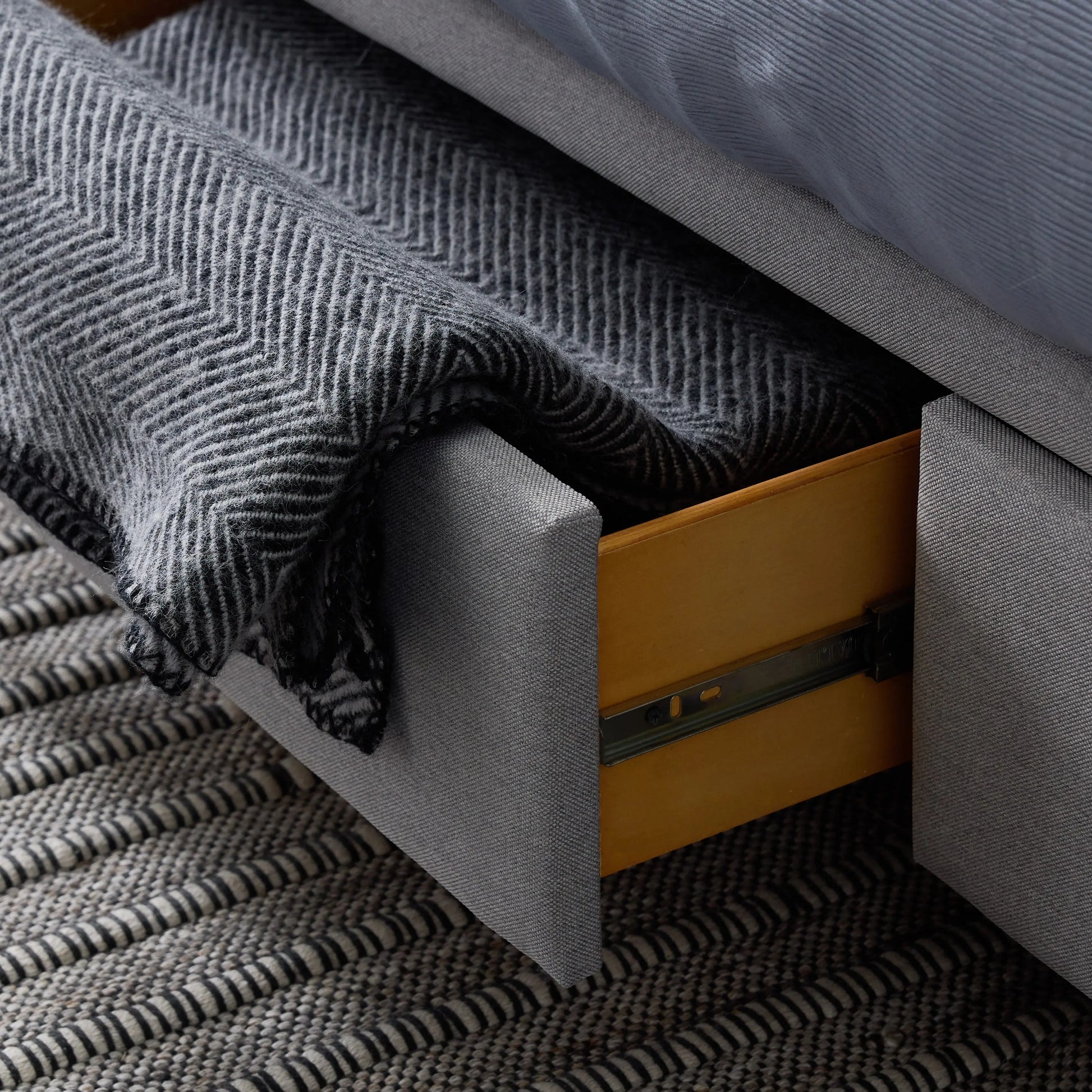 Malouf Duncan platform bed frame with sleek design, shown with a drawer storage option in a modern bedroom setting.