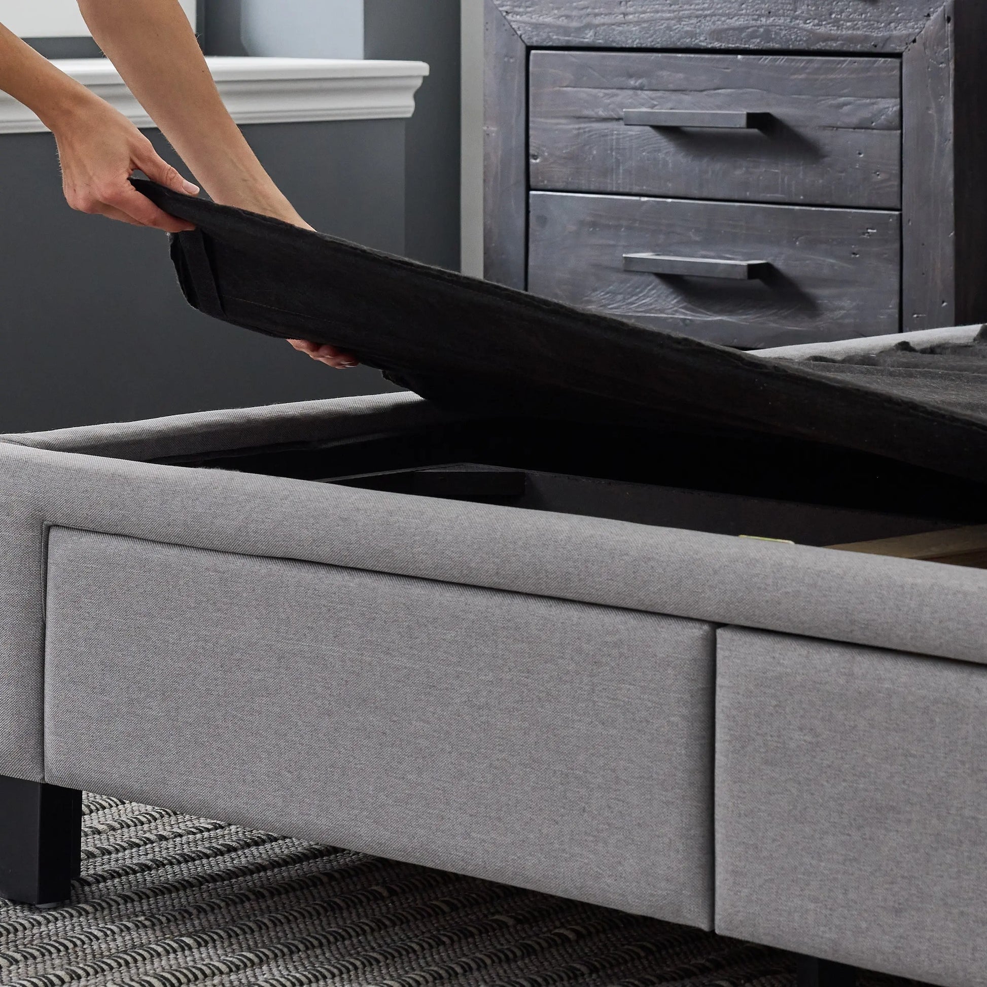 Malouf Duncan platform bed frame with a sleek wooden headboard and sturdy metal legs, shown in a modern bedroom setting.