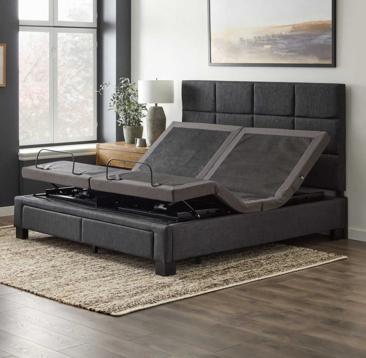Malouf M455 adjustable base with remote control, showing its sleek design and adjustable head and foot positions.