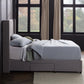 Malouf Blackwell headboard in black fabric with a modern tufted design, shown from a front profile view.
