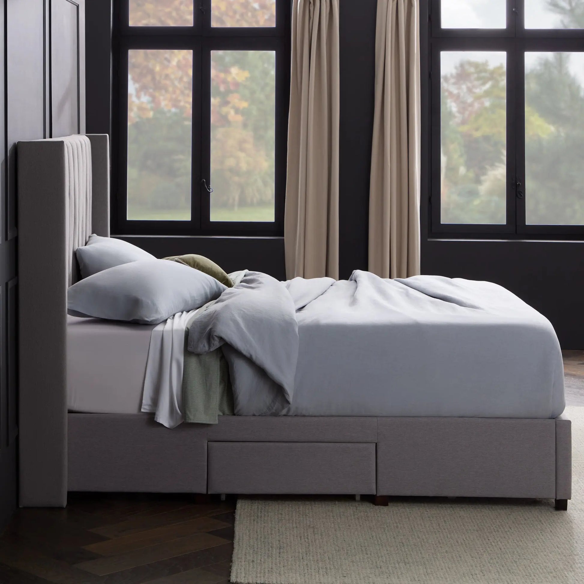 Malouf Blackwell headboard in black fabric with a modern tufted design, shown from a front profile view.