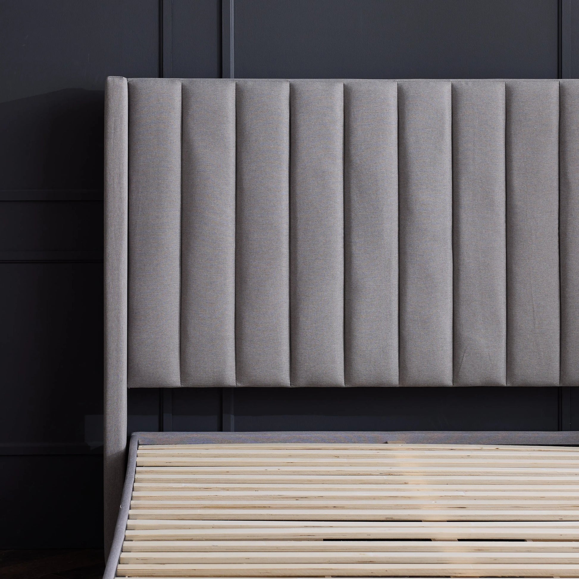 Blackwell headboard by Malouf featuring a sleek, modern design in black fabric with button-tufted details.