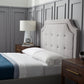 Malouf Carlisle headboard in a neutral fabric with a modern design, shown in a side profile view.