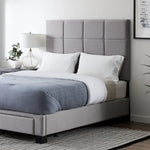 Malouf Scoresby headboard with upholstered fabric and button-tufted design, shown in a modern bedroom setting.