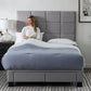 Malouf Scoresby headboard with a sleek, modern design in a neutral fabric, shown in a straight-on view.