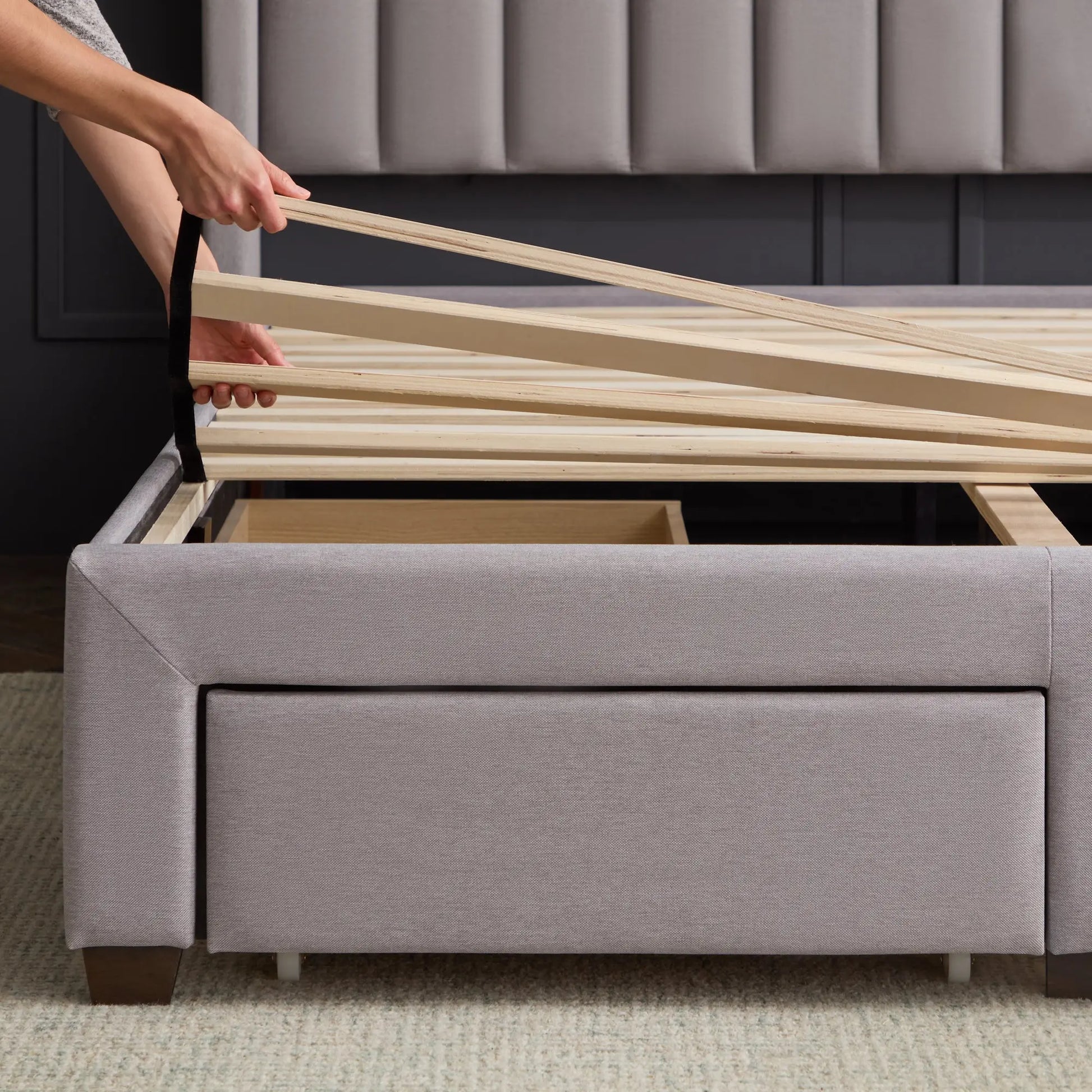 Malouf Watson platform bed frame shown from corner angle, featuring a modern wooden design with clean lines and sturdy construction.