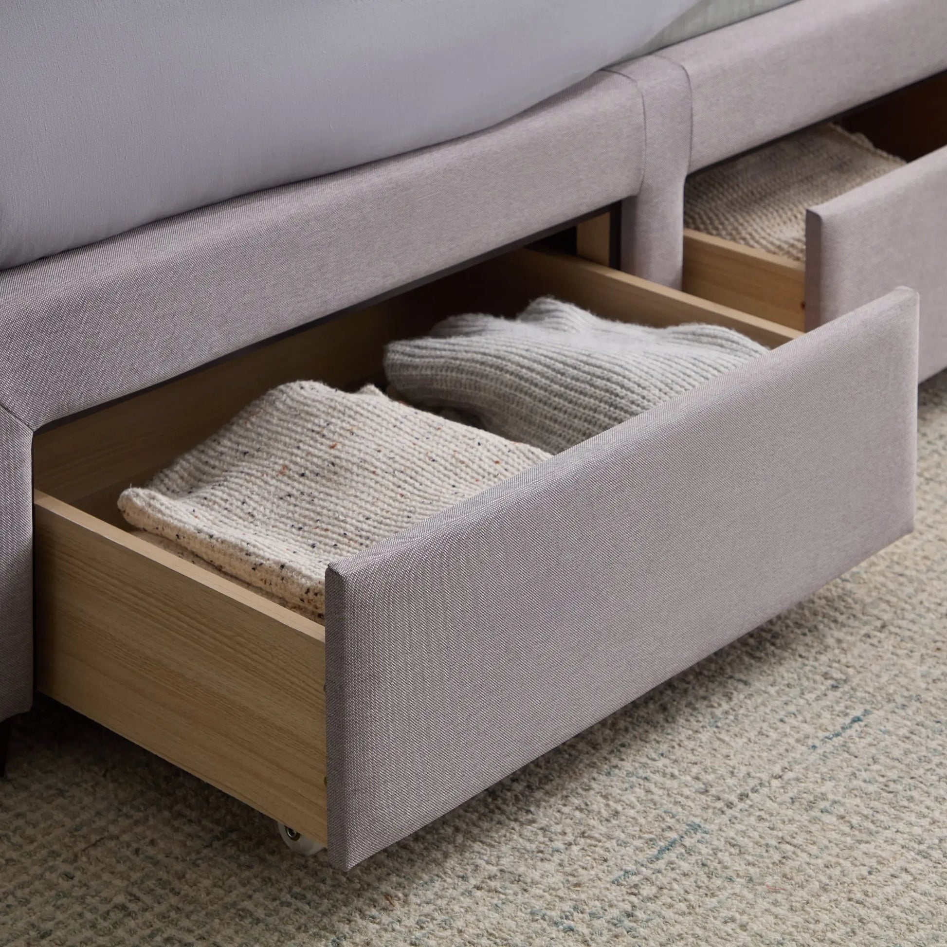 Malouf Watson platform bed frame with built-in storage drawers, showcasing a modern design and sturdy construction.