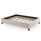 White Eastman platform bed frame by Malouf with a sturdy wooden structure and clean modern design.
