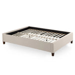 White Eastman platform bed frame by Malouf with a sturdy wooden structure and clean modern design.