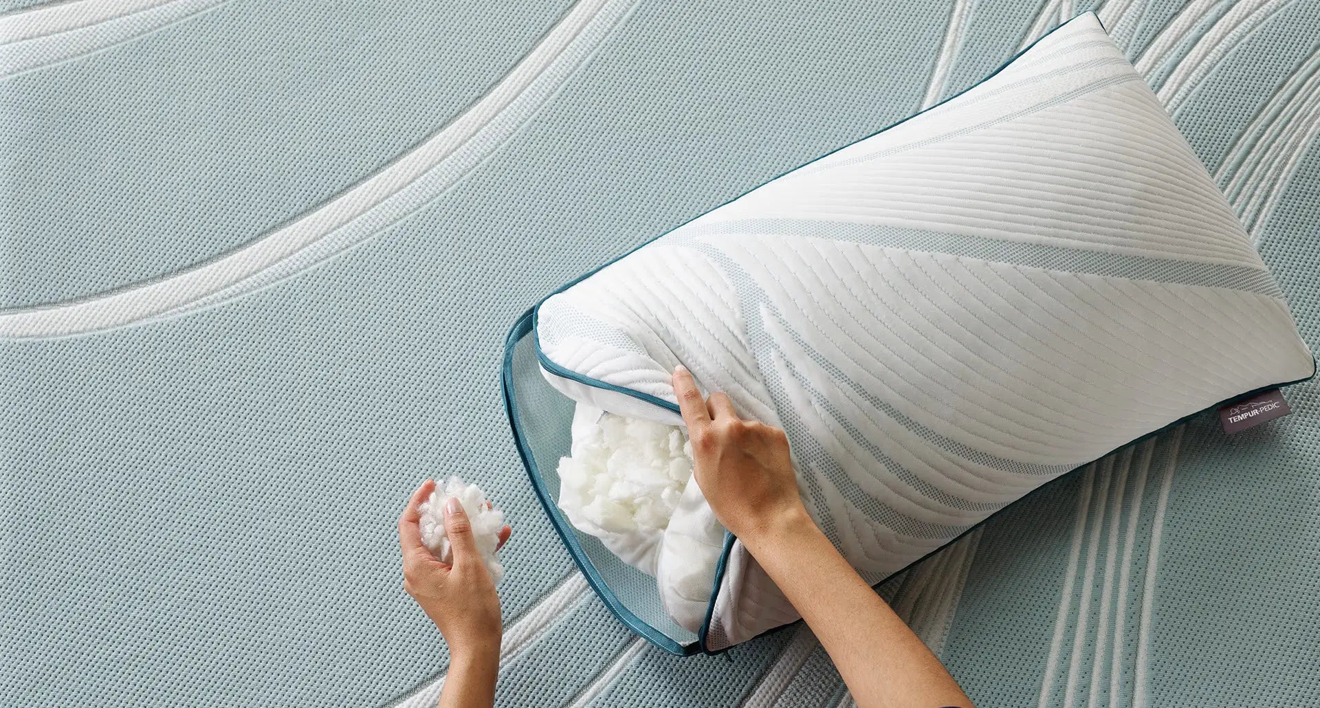TEMPUR-Adapt ProAdjust Pillow by Tempur-Pedic showing a supportive, ergonomic pillow with adjustable height and plush cover.