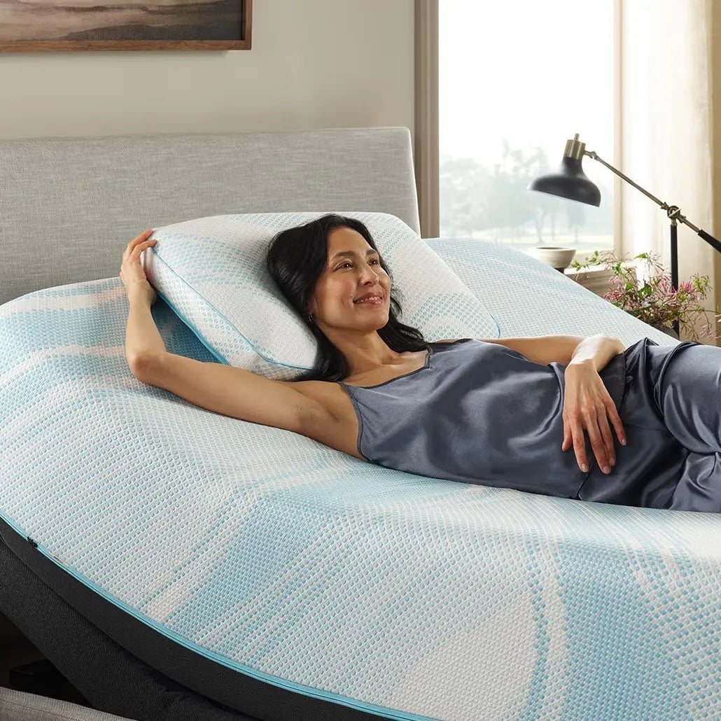Tempur-Pedic Breeze ProHi pillow with ergonomic design and breathable cover, suited for comfortable sleeping support.