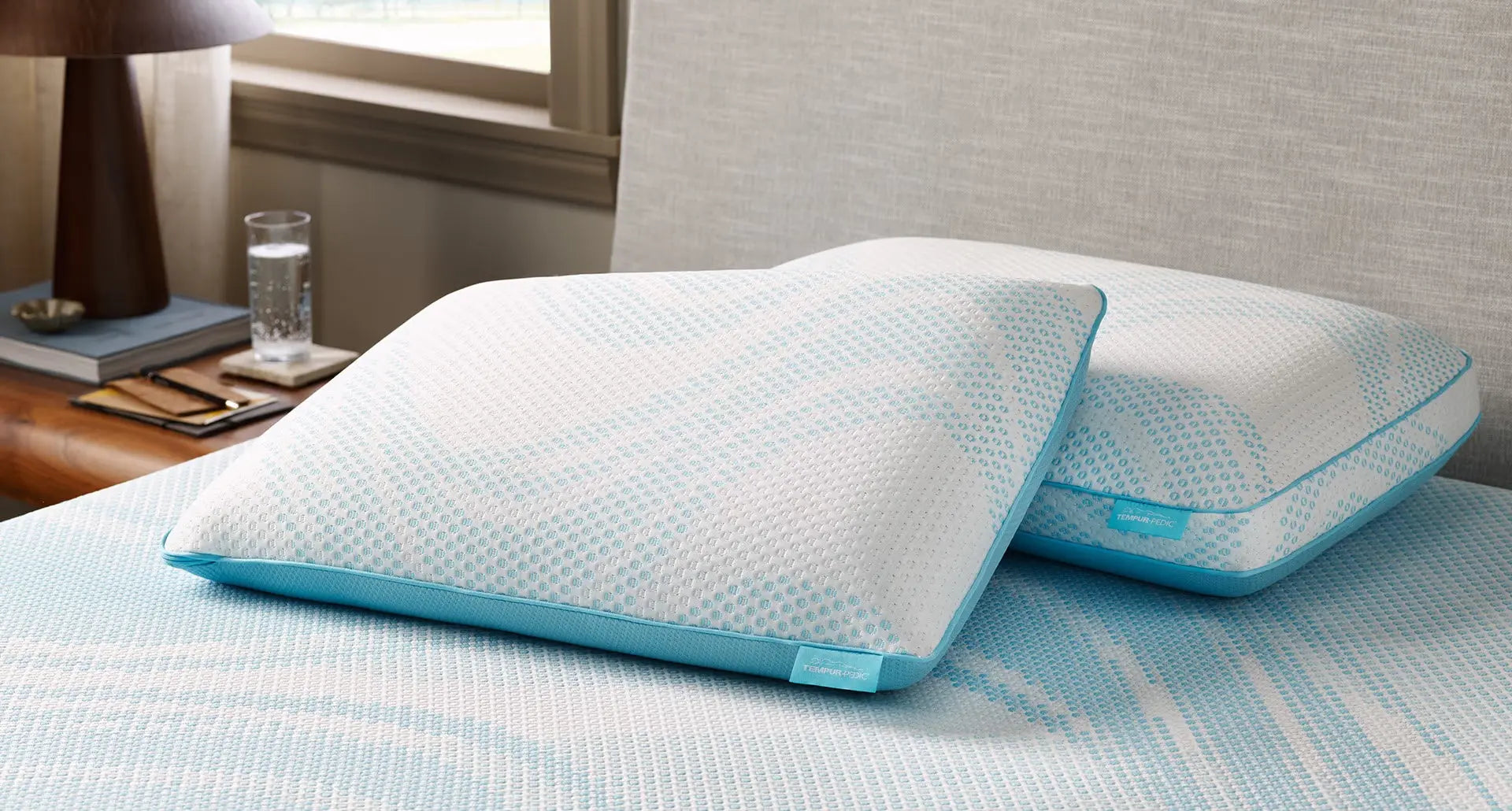 Tempur-Pedic TEMPUR-Breeze ProLo pillow with ergonomic design and cooling fabric for comfortable sleep.