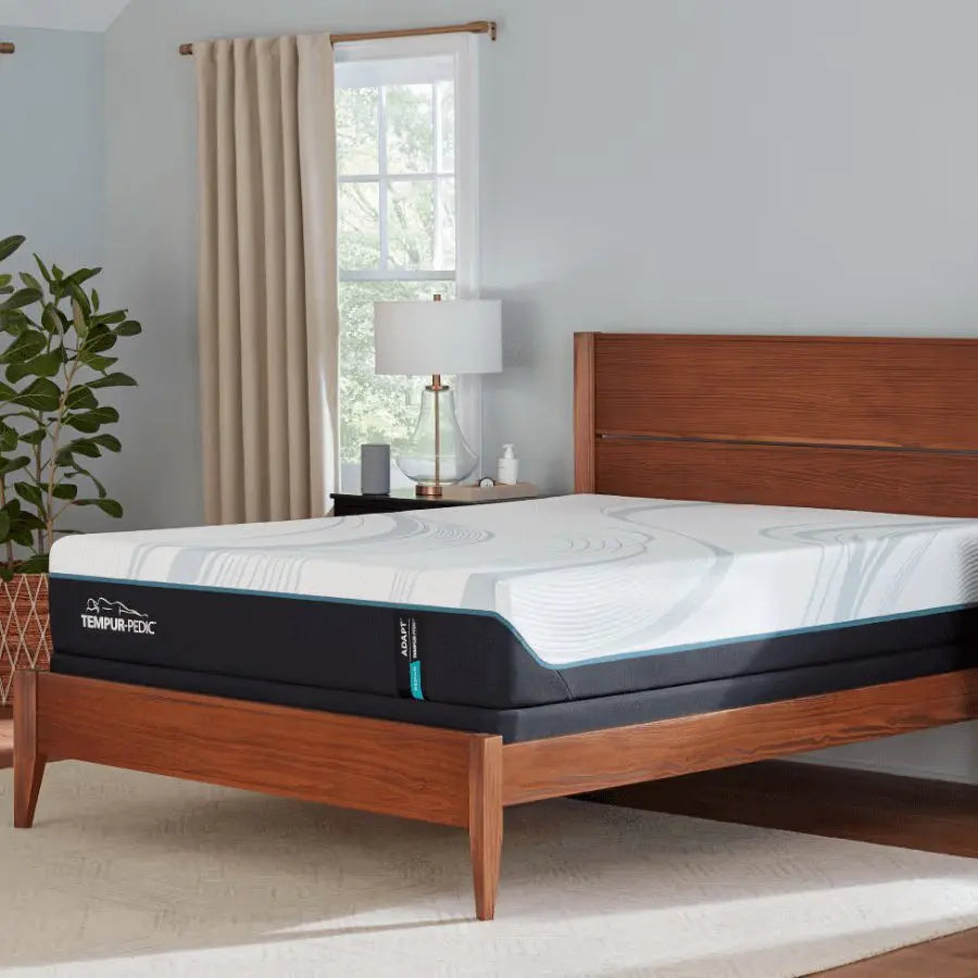 Tempur-Pedic TEMPUR-Adapt medium queen size mattress with plush surface and supportive design, shown in a three-quarter view.