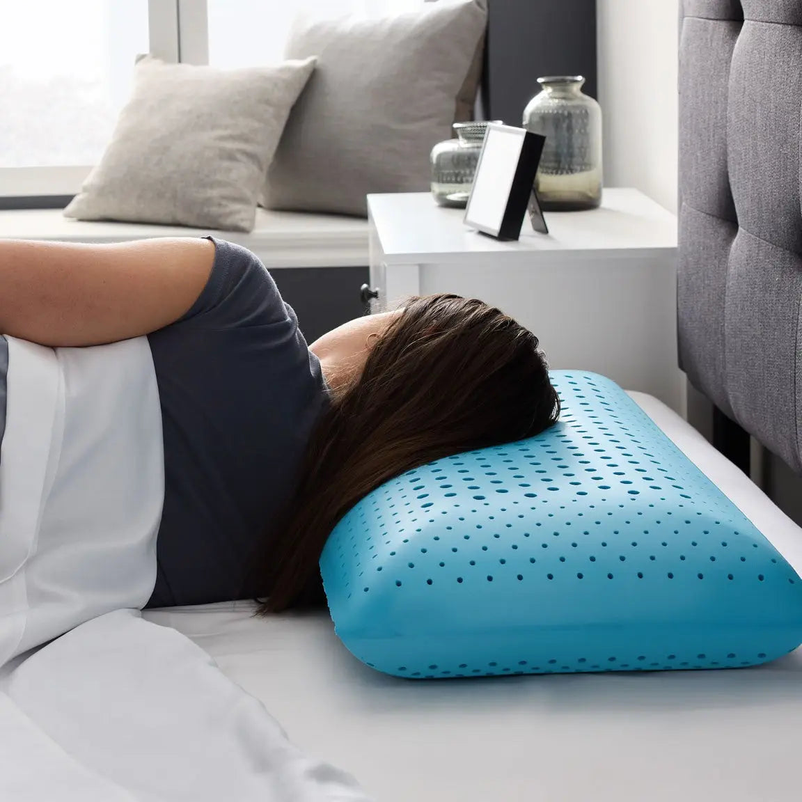Malouf Zoned Dough Pillow with adjustable zoned support and memory foam, shown in a side profile view.