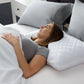 Malouf Shoulder Zoned Dough Pillow with lavender cover, showing its ergonomic design and plush memory foam construction.