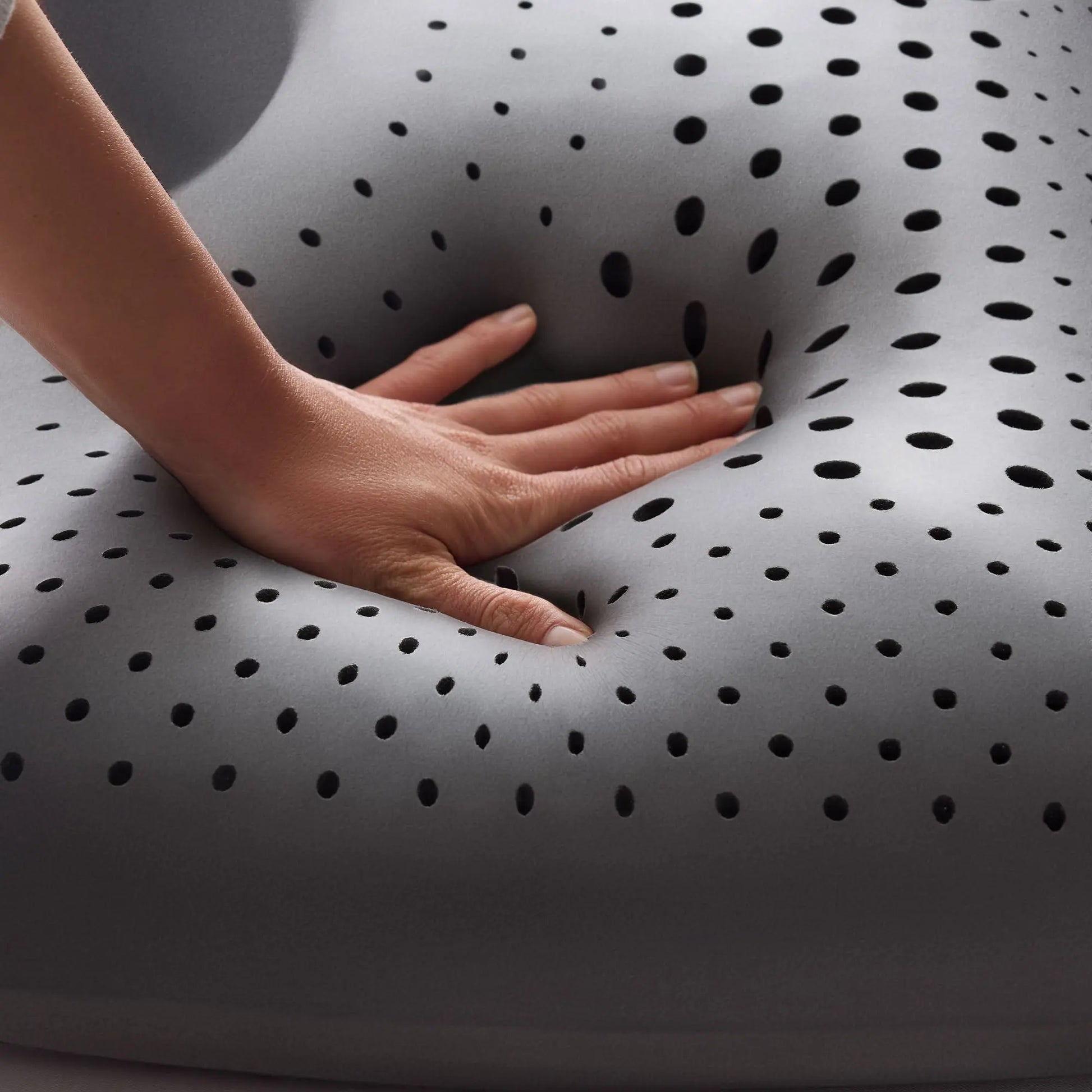 Malouf Shoulder Zoned Dough Pillow with bamboo charcoal cover, showing its ergonomic design and soft, supportive surface.