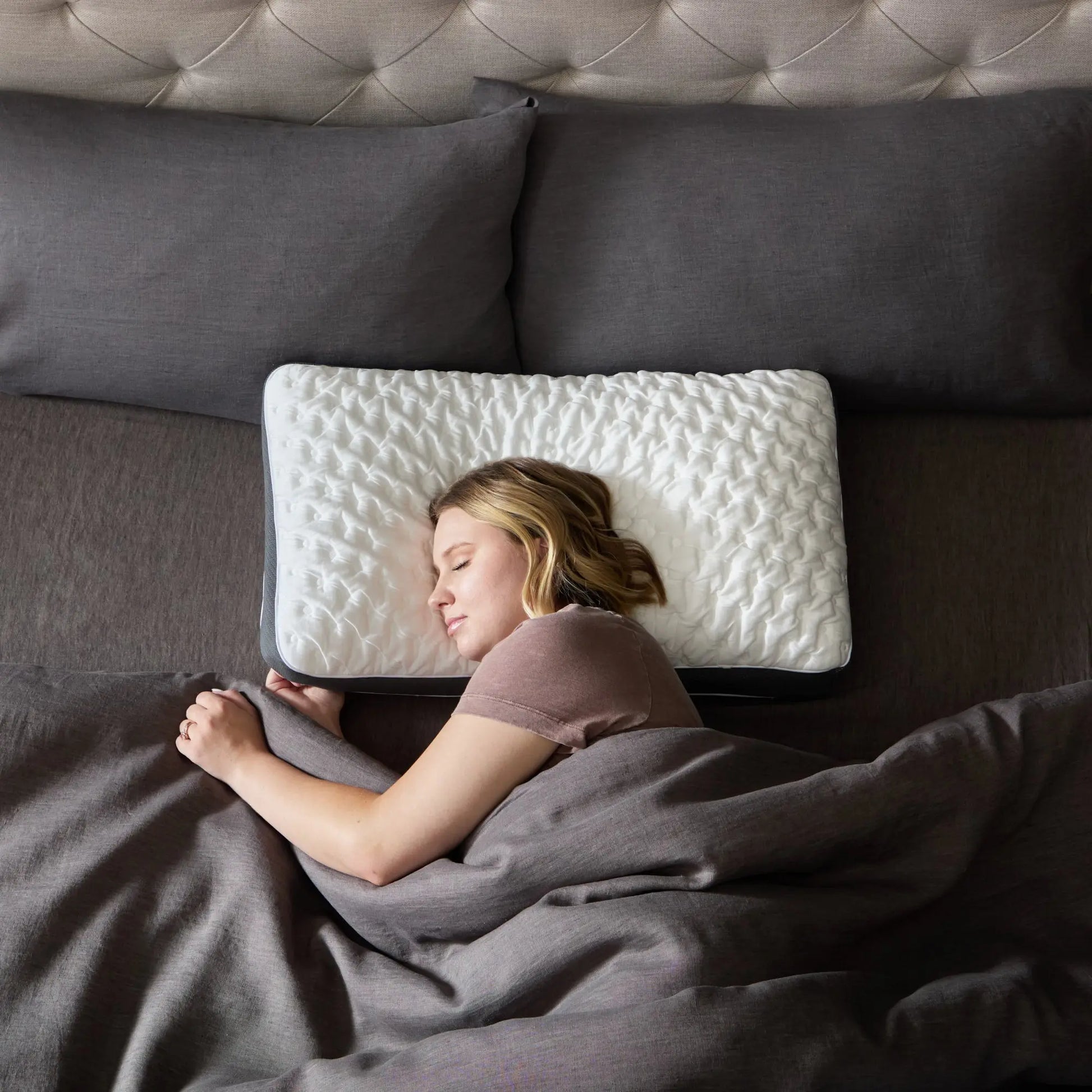 Malouf Quilted Convolution® Pillow with a soft quilted cover, shown from overhead view, highlighting its plush, supportive design.