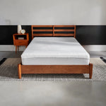 Tempur-Pedic TEMPUR-Protect mattress protector shown on a bed, transparent with fitted edges for full mattress coverage.