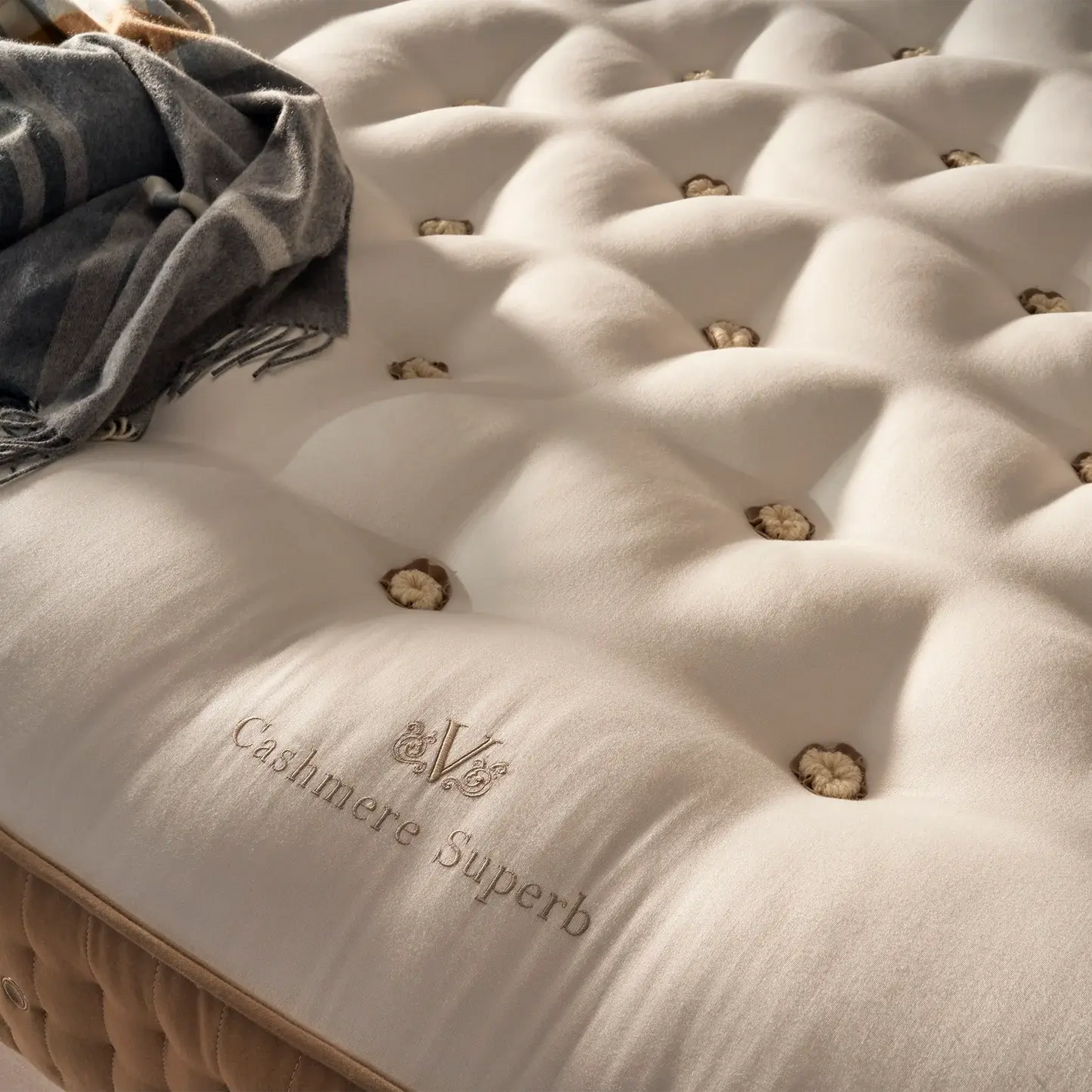 Vispring Cashmere Superb mattress with luxurious cashmere fabric and elegant ticking, displayed in a stylish bedroom setting.