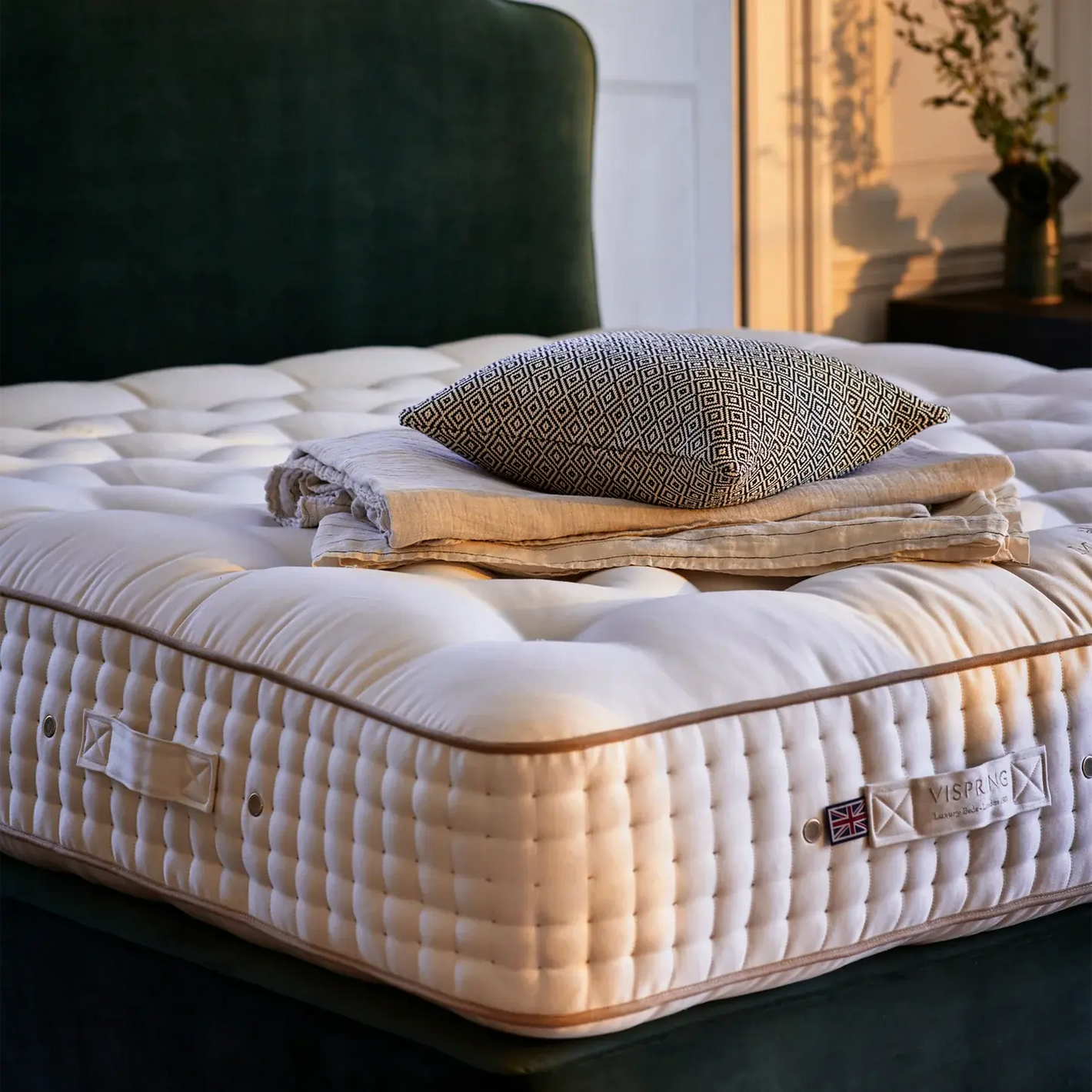Vispring Masterpiece Superb luxury mattress in a stylish bedroom corner with plush bedding and modern decor.